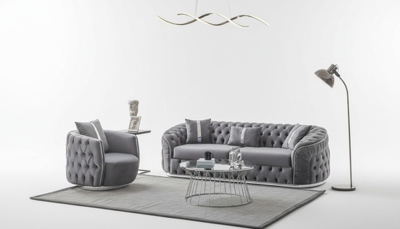 Das Sofa mit Sessel ergänzt die Einrichtung mit Ästhetik und Stil.